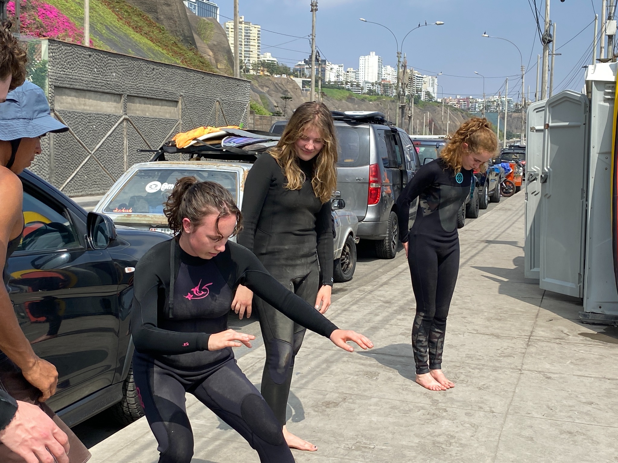 Students practicing their balance while the instructor observes